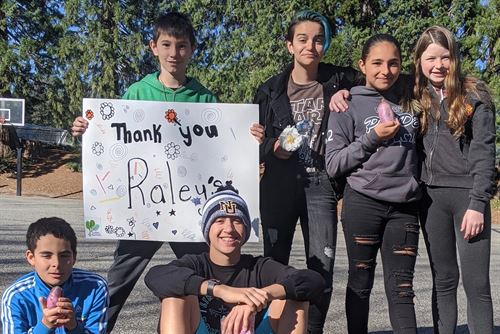 Gilmore students with thank you sign for Raley's