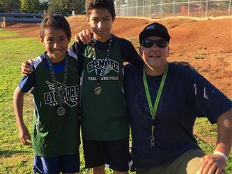 LGMS Invitational Cross Country Meet 2019 - Two boys standing with their coach