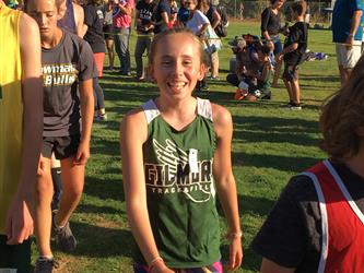 LGMS Invitational Cross Country Meet 2019 - Girl smiling after her race.